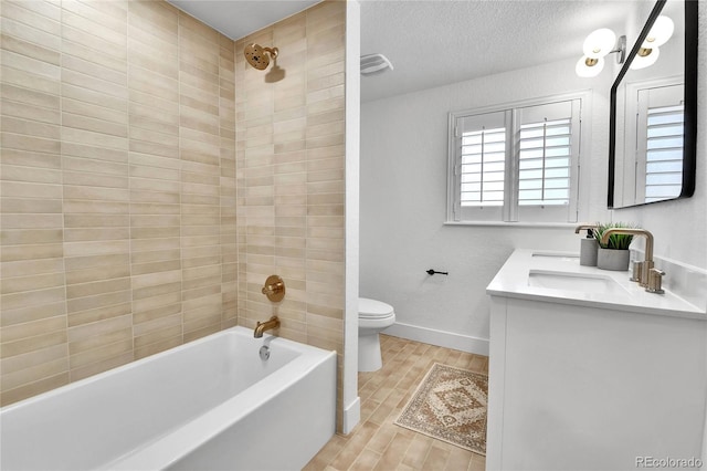 6716 W Rowland Ave, Littleton, CO 80128 - full bathroom with toilet, double vanity, wood finished floors, washtub / shower combination, and baseboards