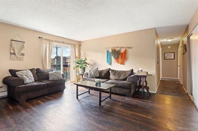 4310 Loomis Ave, Colorado Springs, CO 80906 - living area with wood finished floors, baseboard heating, and a textured ceiling