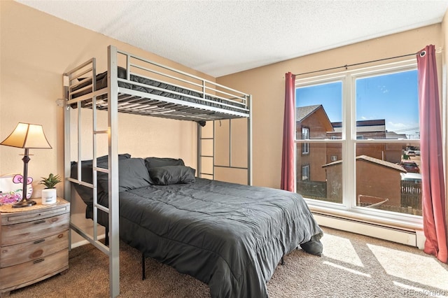 4310 Loomis Ave, Colorado Springs, CO 80906 - bedroom with a baseboard heating unit, carpet, and a textured ceiling