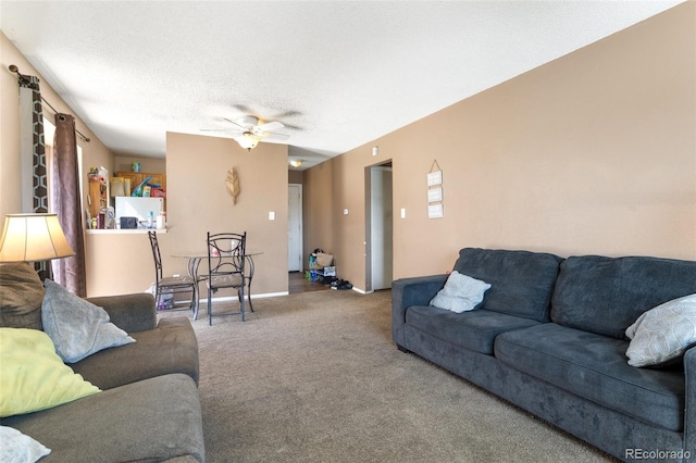 4310 Loomis Ave, Colorado Springs, CO 80906 - living area with ceiling fan, carpet flooring, baseboards, and a textured ceiling