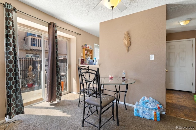 4310 Loomis Ave, Colorado Springs, CO 80906 - carpeted dining room with baseboards, a textured ceiling, a ceiling fan, and a textured wall
