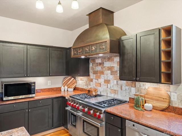 28465 Cragmont Dr, Evergreen, CO 80439 - kitchen featuring appliances with stainless steel finishes, custom exhaust hood, backsplash, and open shelves