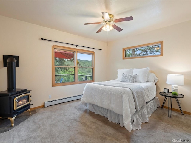 28465 Cragmont Dr, Evergreen, CO 80439 - bedroom featuring a baseboard radiator, multiple windows, and carpet