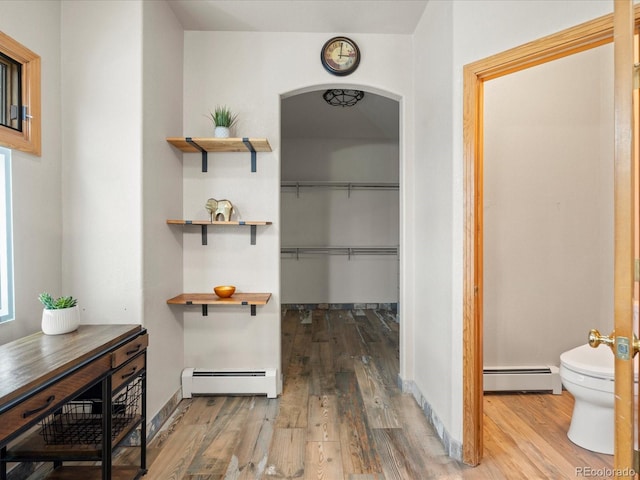 28465 Cragmont Dr, Evergreen, CO 80439 - hall with a baseboard heating unit and wood finished floors