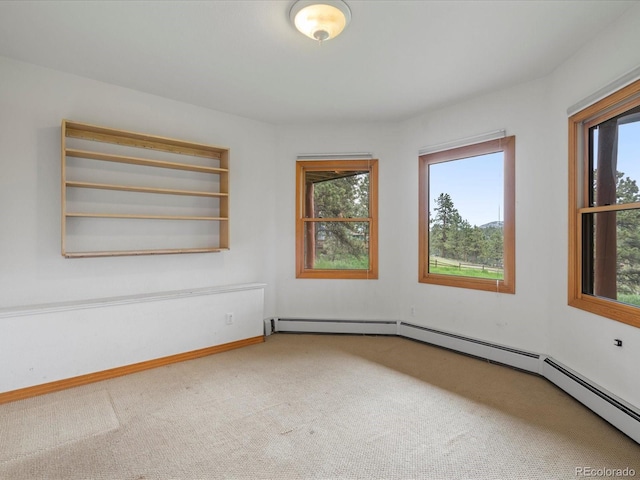 28465 Cragmont Dr, Evergreen, CO 80439 - unfurnished room with carpet floors, plenty of natural light, and baseboard heating