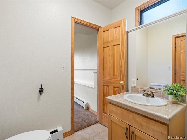 28465 Cragmont Dr, Evergreen, CO 80439 - bathroom featuring baseboard heating, vanity, and tile patterned floors