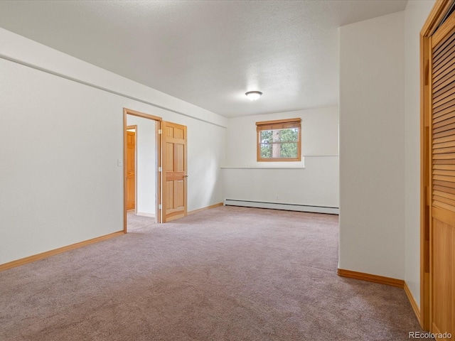 28465 Cragmont Dr, Evergreen, CO 80439 - unfurnished bedroom featuring a baseboard heating unit, carpet, a closet, and a textured ceiling