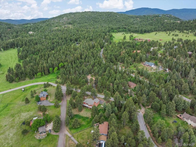28465 Cragmont Dr, Evergreen, CO 80439 - aerial view of property and surrounding area with a forest and a mountain backdrop