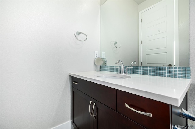 bathroom with backsplash and vanity