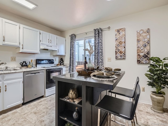 17681 E Loyola Dr Unit E, Aurora, CO 80013 - kitchen with stainless steel dishwasher, range with electric cooktop, under cabinet range hood, white cabinets, and open shelves
