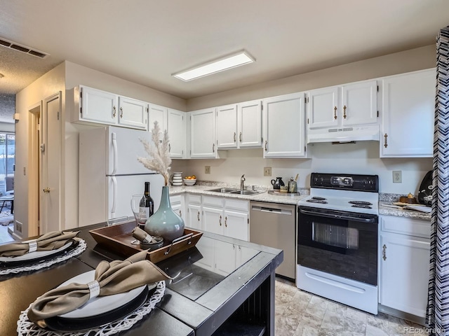 17681 E Loyola Dr Unit E, Aurora, CO 80013 - kitchen with dishwasher, electric range oven, under cabinet range hood, white cabinets, and freestanding refrigerator
