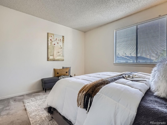 17681 E Loyola Dr Unit E, Aurora, CO 80013 - bedroom with carpet and a textured ceiling