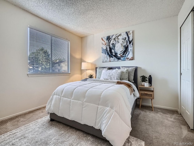 17681 E Loyola Dr Unit E, Aurora, CO 80013 - bedroom with carpet flooring and a textured ceiling