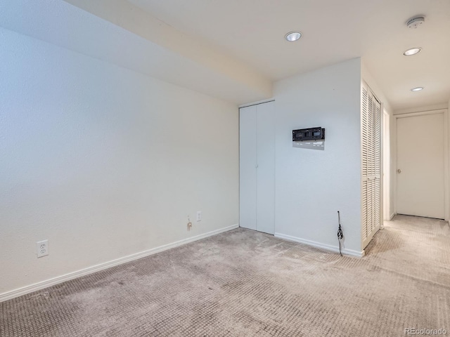 17681 E Loyola Dr Unit E, Aurora, CO 80013 - spare room featuring light carpet, a smoke detector, and recessed lighting