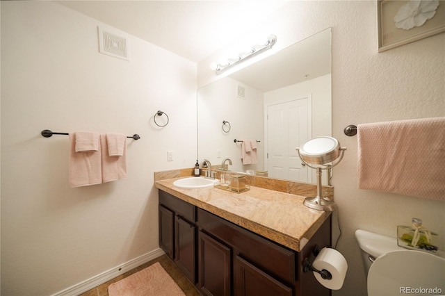 5732 S Addison Way # E, Aurora, CO 80016 - bathroom with vanity, toilet, and baseboards