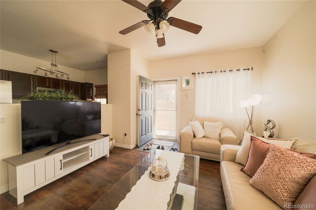 5732 S Addison Way # E, Aurora, CO 80016 - living area with dark wood-type flooring, baseboards, and ceiling fan