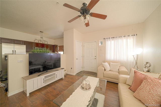 5732 S Addison Way # E, Aurora, CO 80016 - living area featuring a ceiling fan, dark wood-type flooring, baseboards, and a textured ceiling