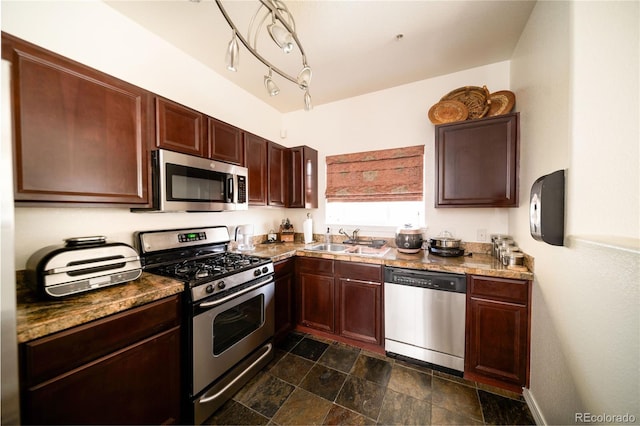 5732 S Addison Way # E, Aurora, CO 80016 - kitchen featuring stainless steel appliances, a sink, dark stone finish flooring, dark countertops, and dark brown cabinetry