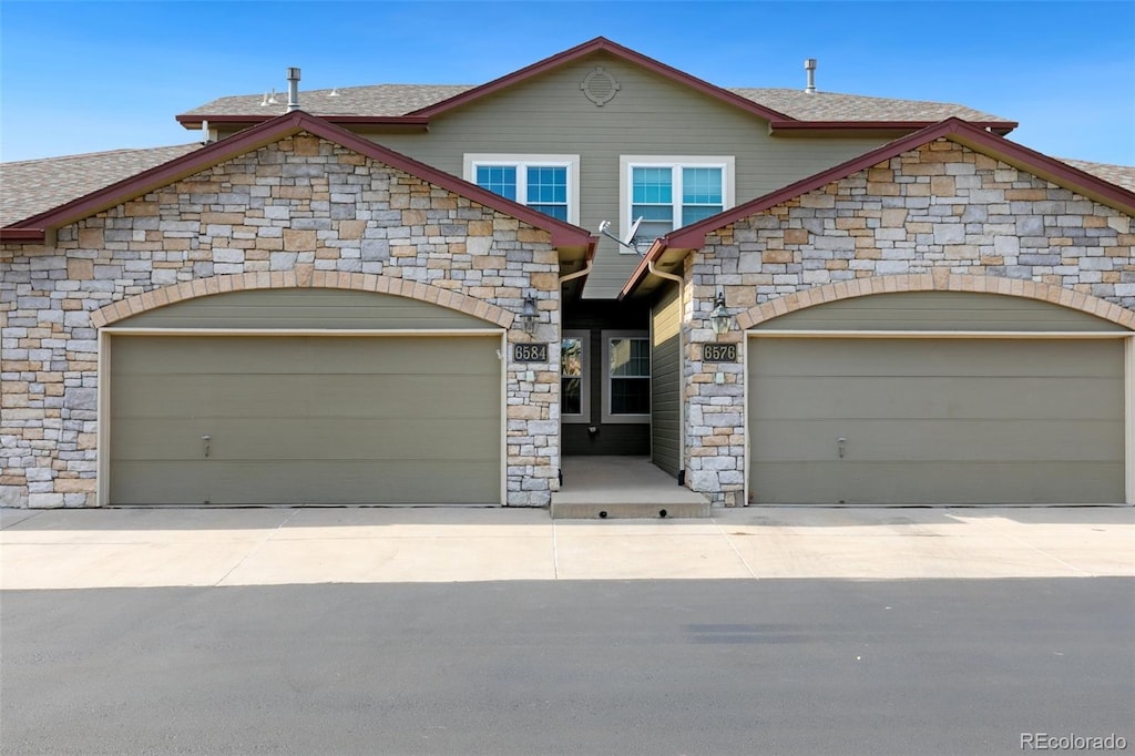 view of front of property with a garage