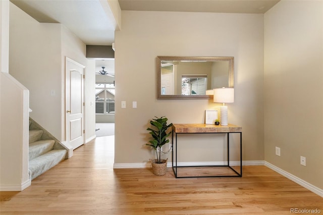 corridor with light hardwood / wood-style flooring