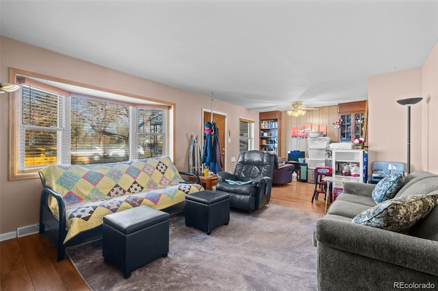 living room with ceiling fan and hardwood / wood-style flooring