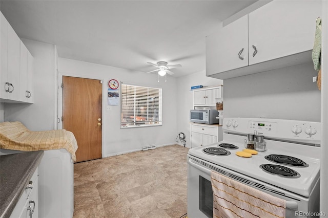 kitchen featuring ceiling fan, white cabinets, and white electric range oven