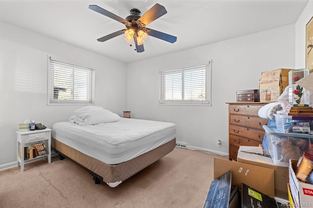 bedroom with ceiling fan and carpet floors