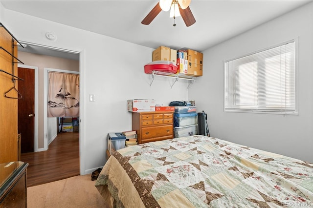 carpeted bedroom with ceiling fan