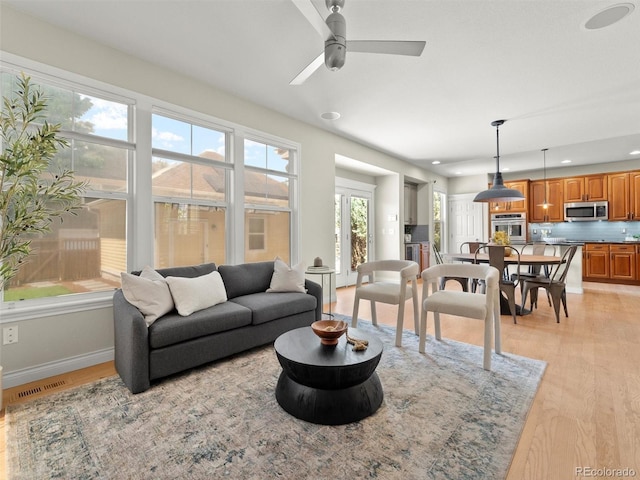 2821 Fulton St, Denver, CO 80238 - living room featuring light wood-style floors, ceiling fan, and recessed lighting