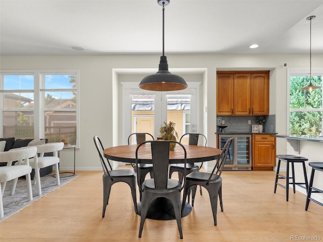 2821 Fulton St, Denver, CO 80238 - dining room with beverage cooler, light wood-style floors, and recessed lighting