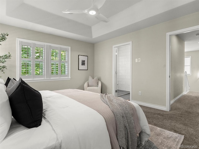 2821 Fulton St, Denver, CO 80238 - bedroom with carpet floors, a tray ceiling, ceiling fan, and ensuite bathroom