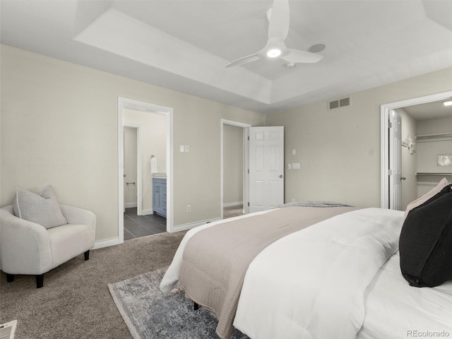 2821 Fulton St, Denver, CO 80238 - bedroom featuring carpet flooring, a raised ceiling, a walk in closet, ensuite bath, and ceiling fan