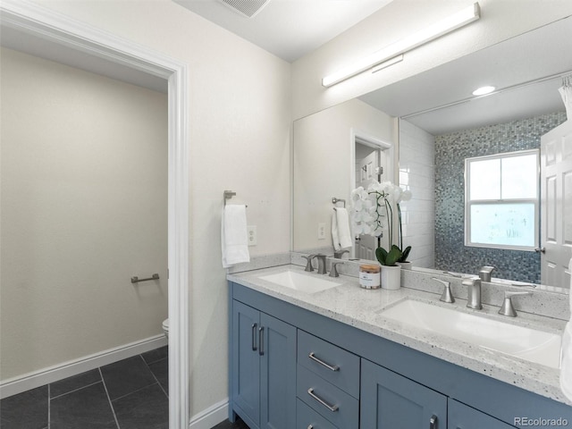 2821 Fulton St, Denver, CO 80238 - bathroom with double vanity and tile patterned flooring