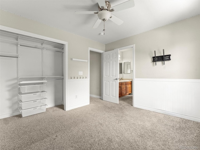 2821 Fulton St, Denver, CO 80238 - unfurnished bedroom with a closet, carpet flooring, wainscoting, and a ceiling fan
