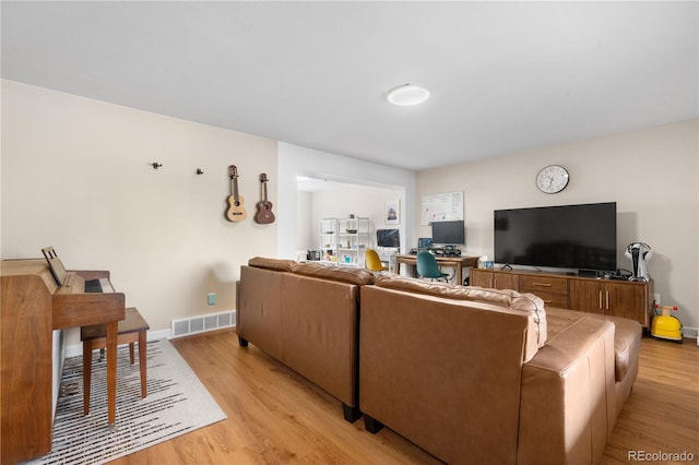 1758 S Tucson St, Aurora, CO 80012 - living area with light wood-style floors and baseboards