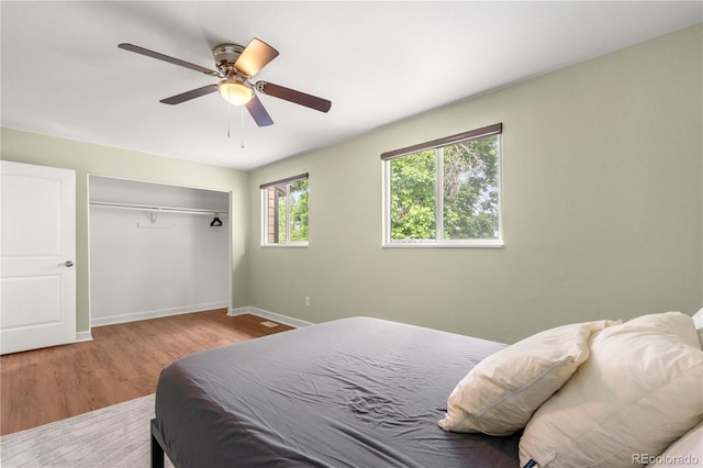 1758 S Tucson St, Aurora, CO 80012 - bedroom with baseboards, wood finished floors, a closet, and a ceiling fan