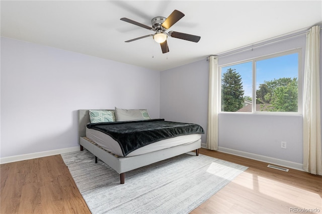 1758 S Tucson St, Aurora, CO 80012 - bedroom with baseboards, wood finished floors, and a ceiling fan