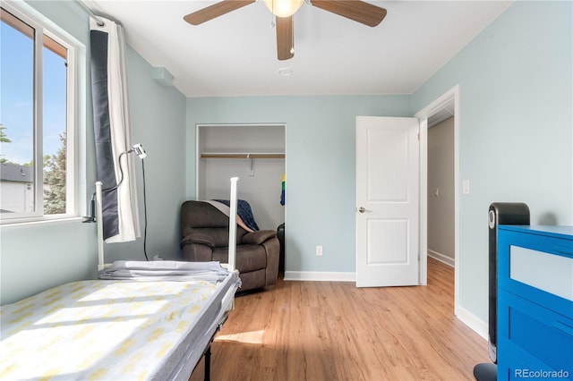 1758 S Tucson St, Aurora, CO 80012 - bedroom featuring light wood finished floors, a closet, baseboards, and a ceiling fan