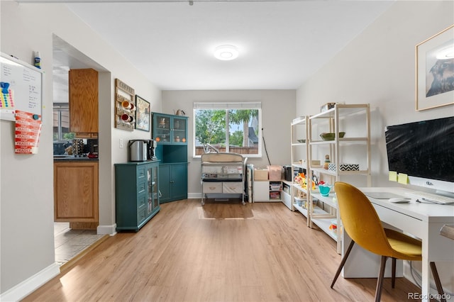 1758 S Tucson St, Aurora, CO 80012 - office area featuring light wood-style floors and baseboards
