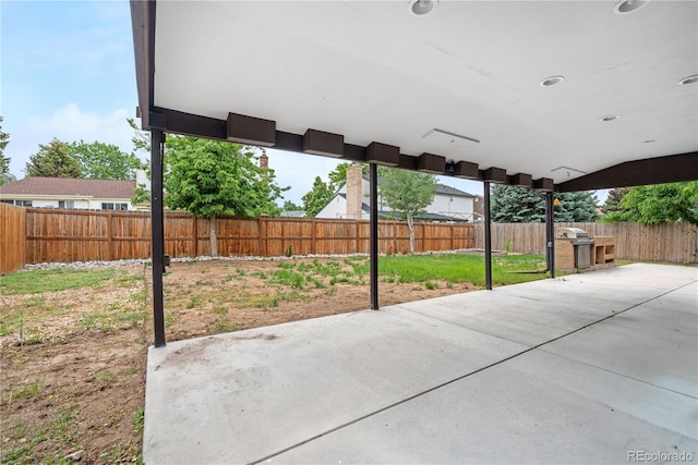 1758 S Tucson St, Aurora, CO 80012 - fenced backyard with a patio area and a grill