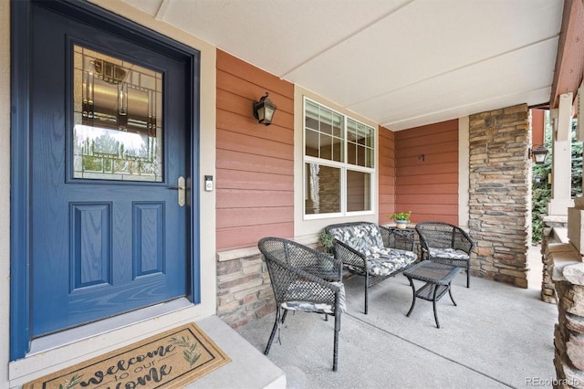 5810 Moss Ct, Golden, CO 80403 - property entrance featuring a porch and stone siding