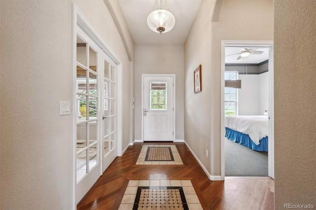 5810 Moss Ct, Golden, CO 80403 - entryway with wood finished floors, healthy amount of natural light, and a textured wall