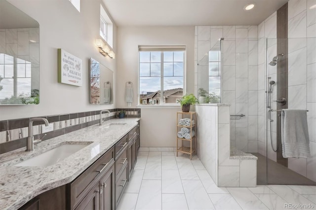 5810 Moss Ct, Golden, CO 80403 - bathroom with marble finish flooring, a shower stall, double vanity, and recessed lighting