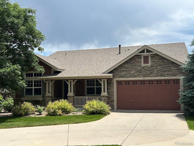 5810 Moss Ct, Golden, CO 80403 - craftsman house with a porch, stone siding, driveway, a garage, and a shingled roof