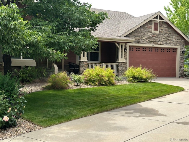 5810 Moss Ct, Golden, CO 80403 - craftsman-style home featuring stone siding, a porch, an attached garage, a front lawn, and concrete driveway