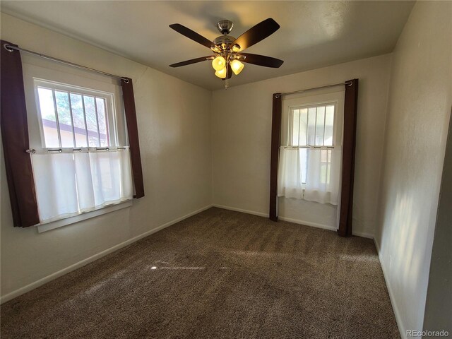 unfurnished room featuring ceiling fan and carpet floors