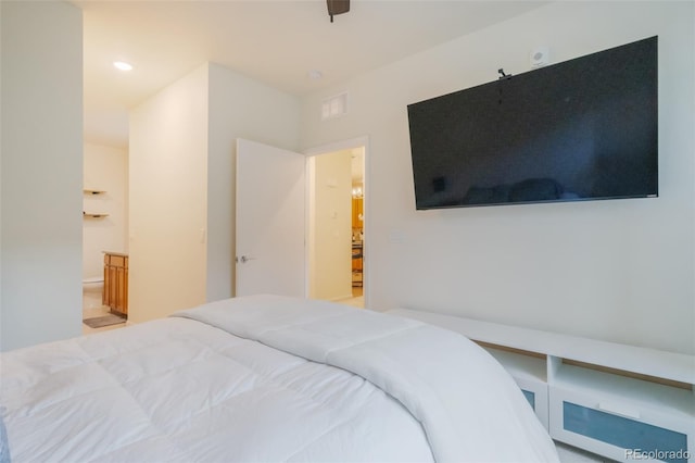 bedroom with ceiling fan and ensuite bathroom