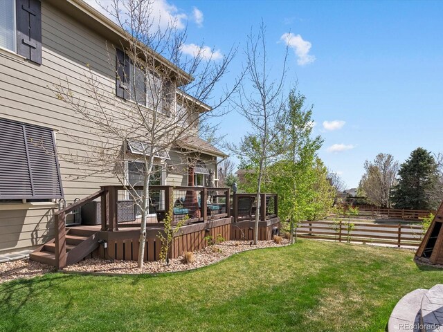 10273 Salida St, Commerce City, CO 80022 - view of yard featuring a wooden deck and fence