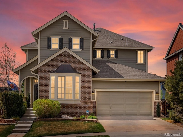 10273 Salida St, Commerce City, CO 80022 - traditional-style home with a shingled roof, driveway, and brick siding