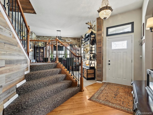 10273 Salida St, Commerce City, CO 80022 - entrance foyer with an inviting chandelier, wood finished floors, and stairs